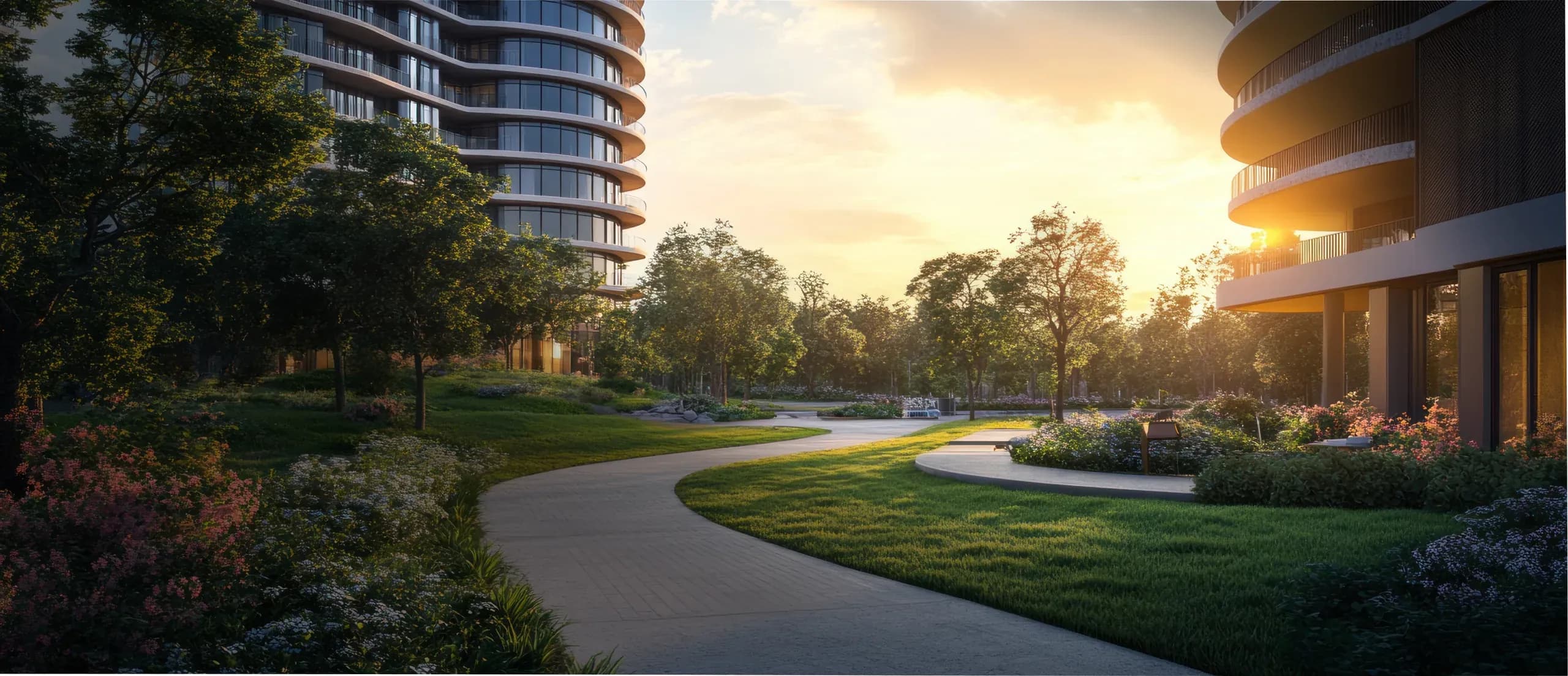 Curving garden path between residential buildings at sunset